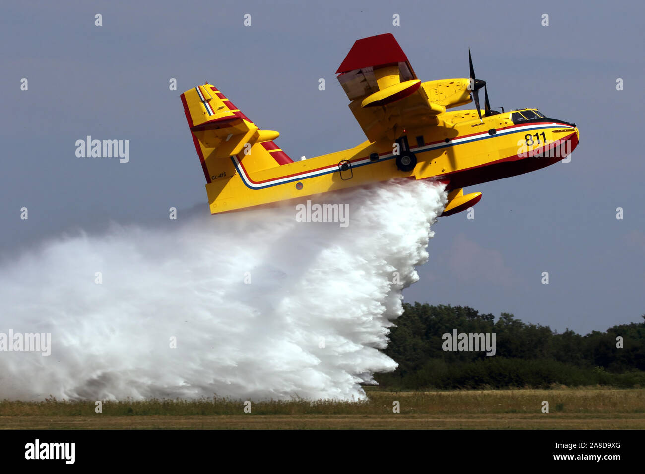 Waterbomber - Fire Fighter Aircraft dropping water Stock Photo