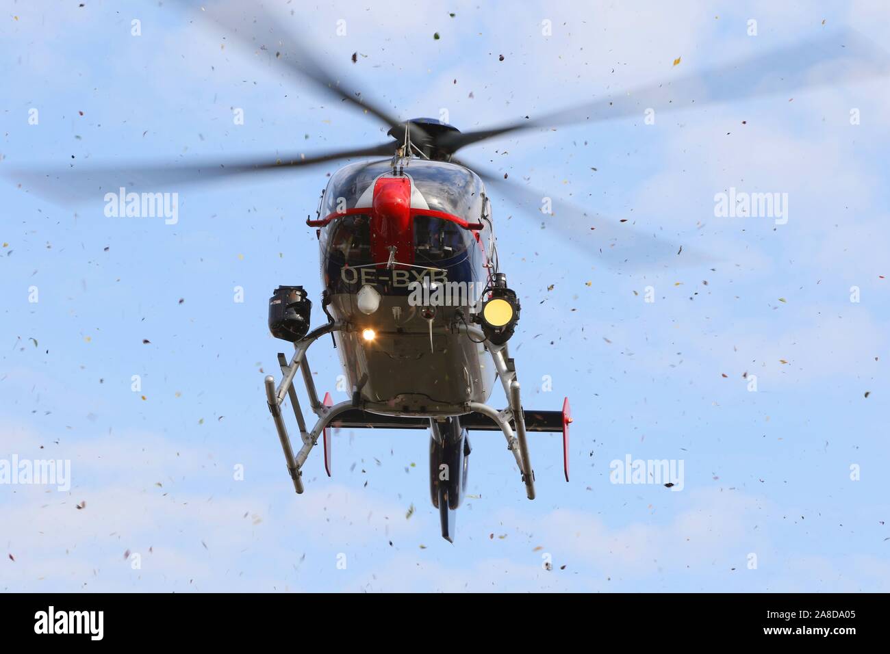 Police Helicopter landing in a storm Stock Photo