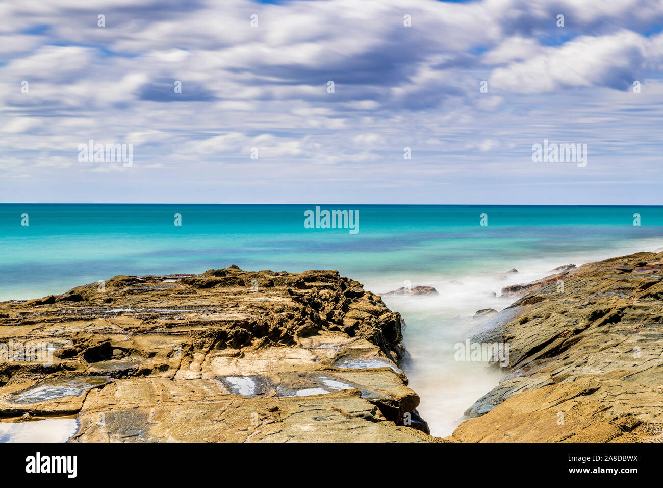 The rocky shoreline surrounding the seaside town of Lorne, Victoria, Australia. Stock Photo