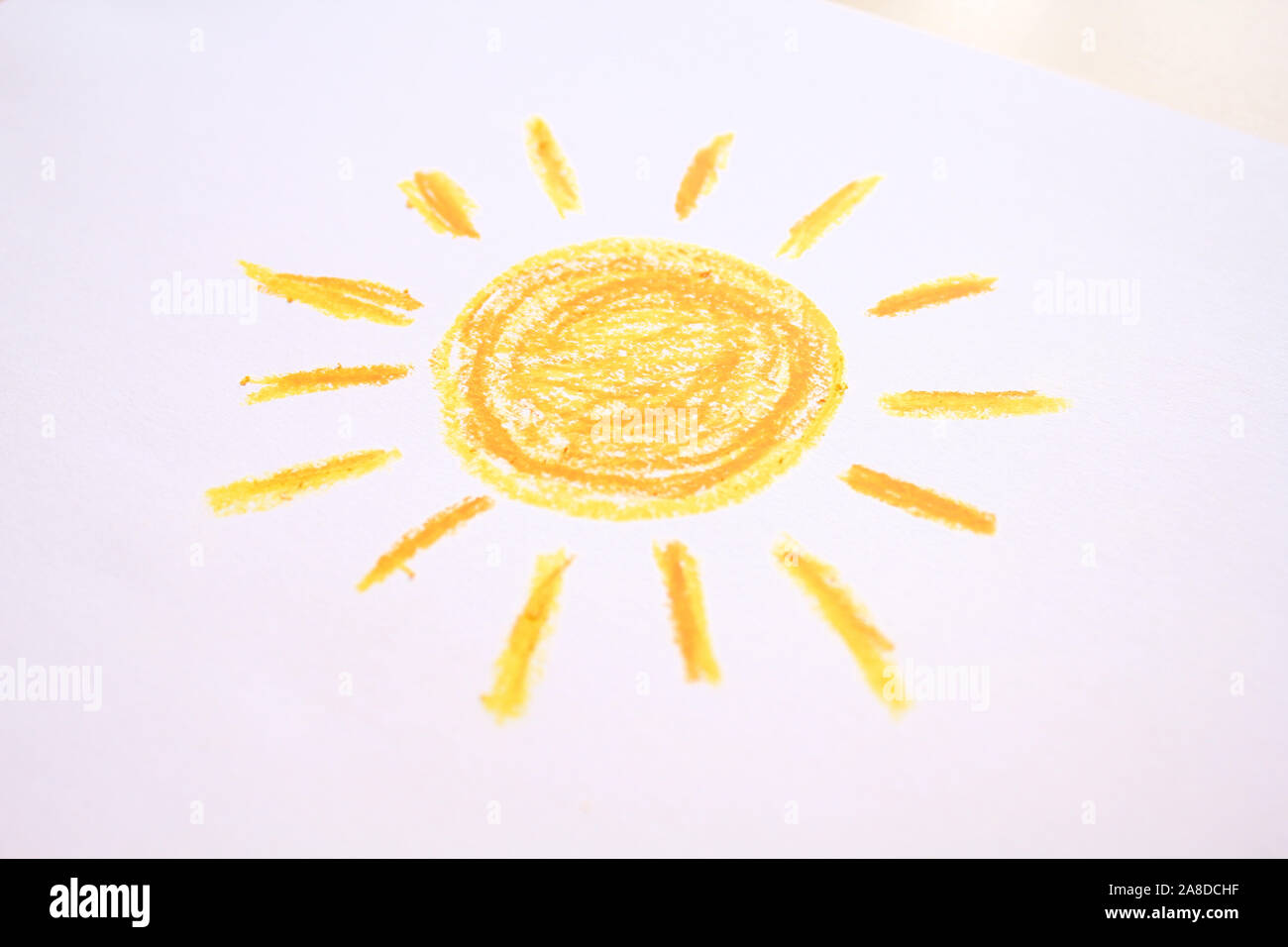 Photo of sun crayon drawing on paper Stock Photo Alamy