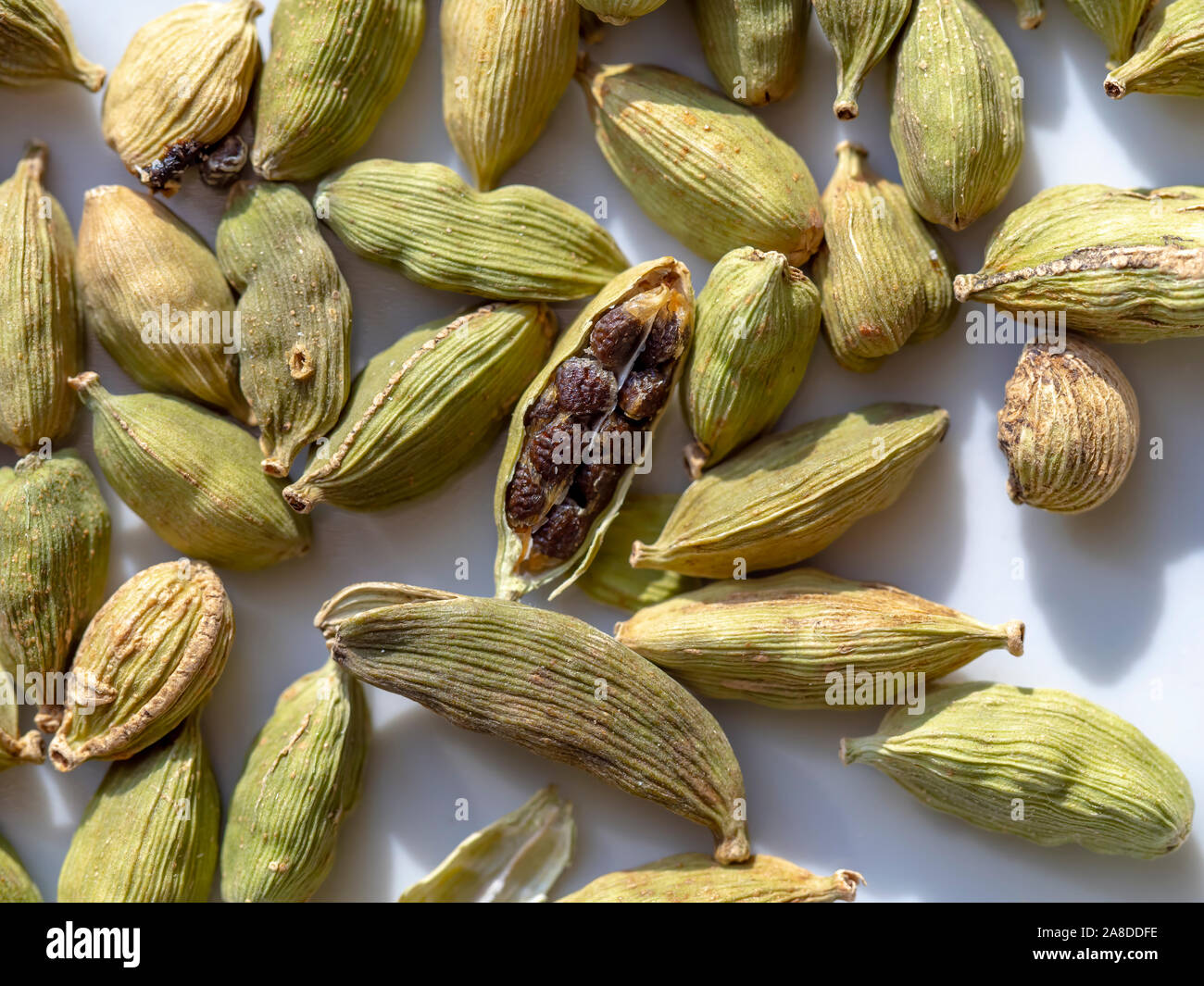 Cardamom seeds is a spice made from the seeds of several plants in the genera Elettaria and Amomum in the family Zingiberaceae. Stock Photo