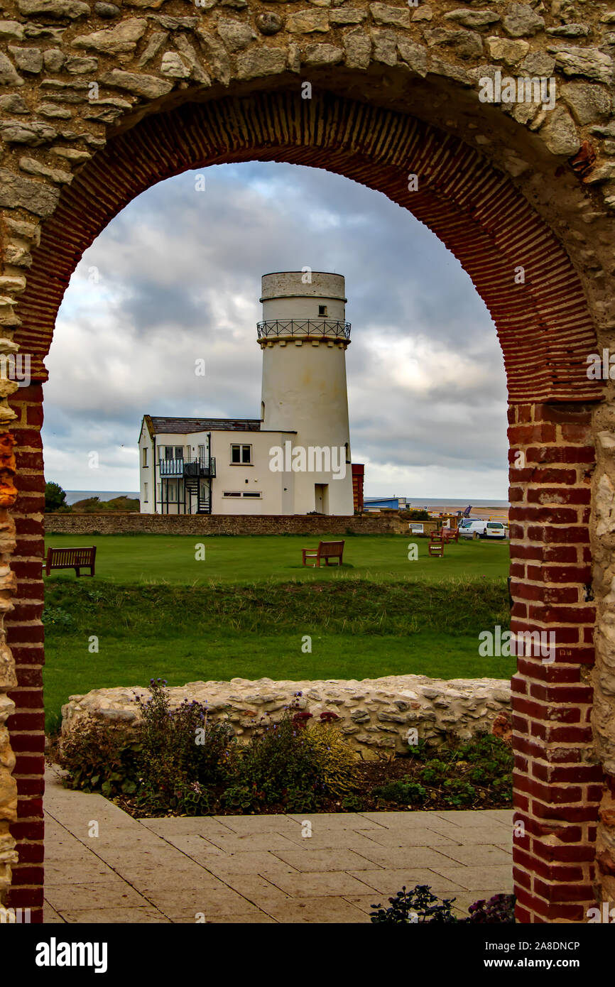 Hunstanton lighthouse framed by the archway in the ruins of St Edmunds ...