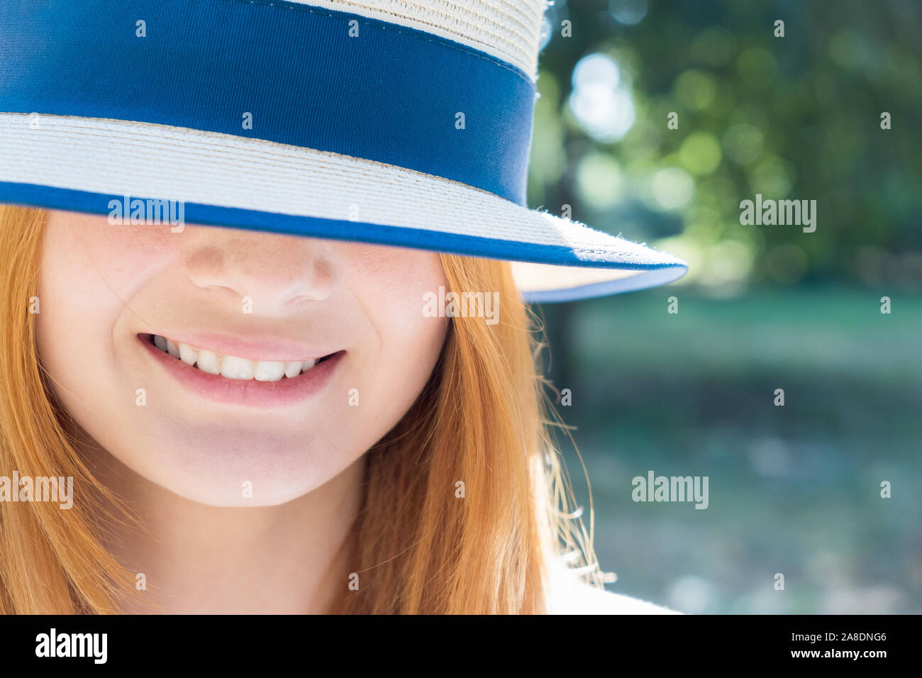 Portrait of gorgeous smiling teenage girl in yellow hat and with red ...