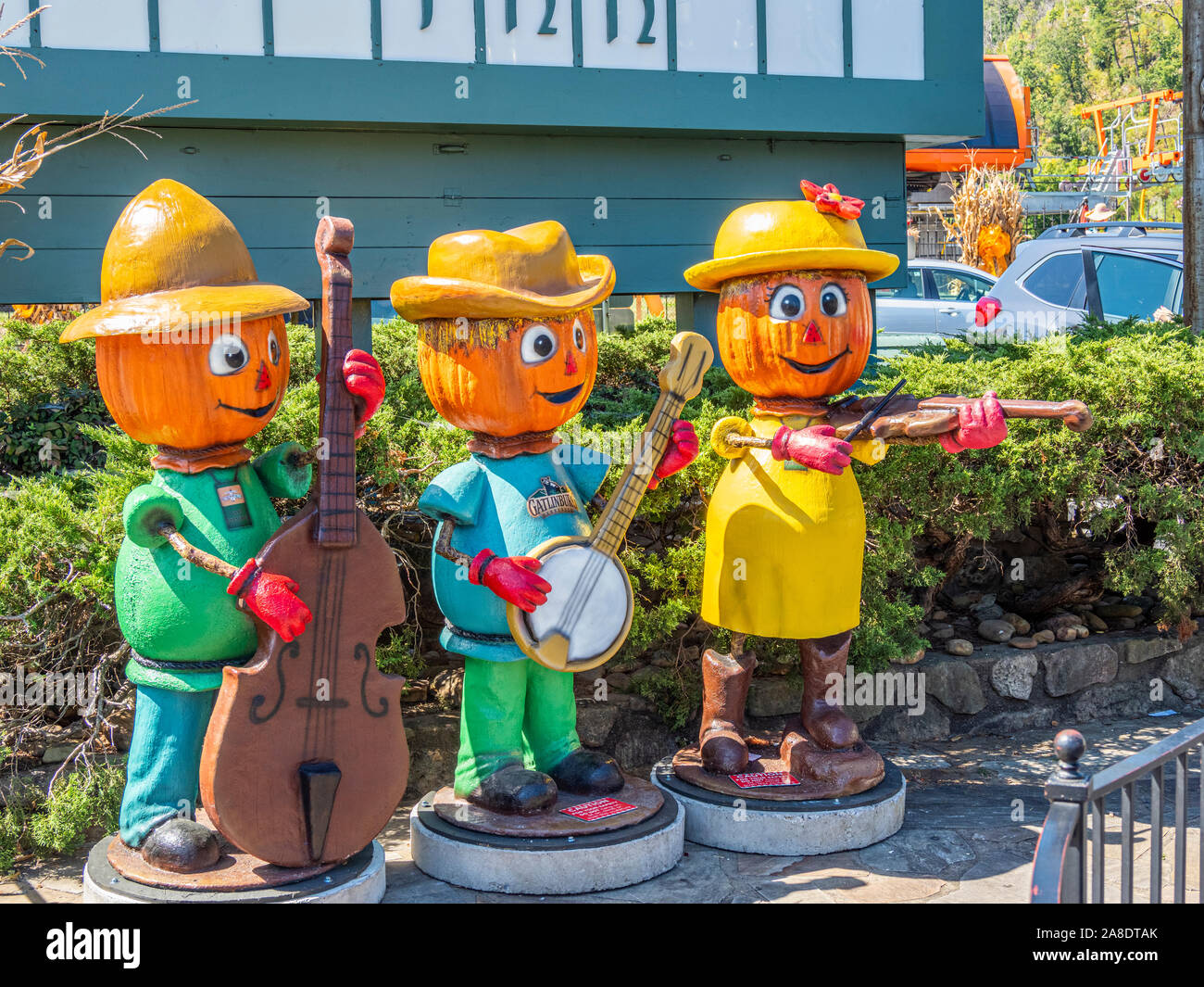 Fall Pumpkin head fiqures playing musical instruments in downtown Gatlinburg Tennessee in the United States Stock Photo