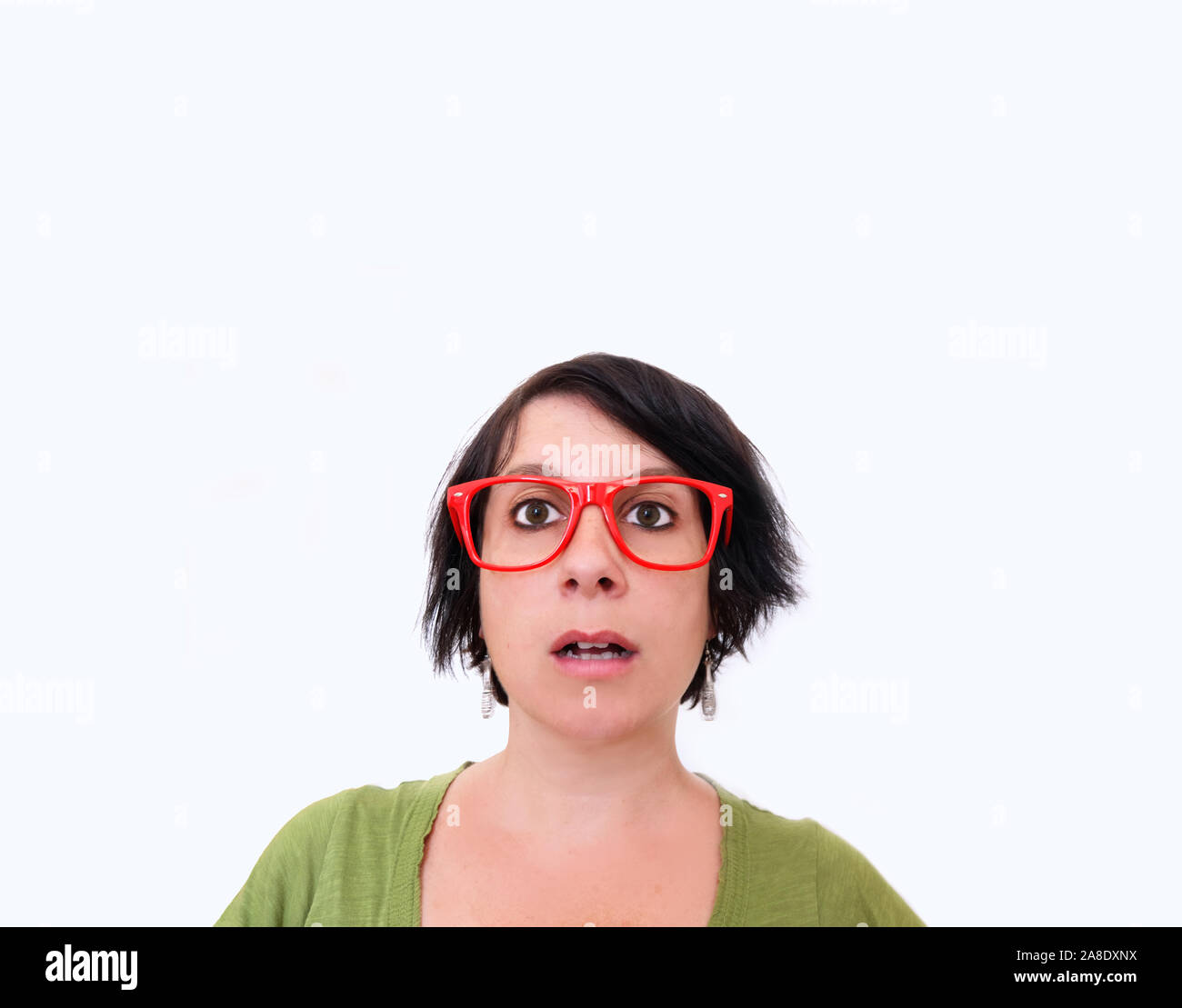 woman with red glasses making a surprised face Stock Photo
