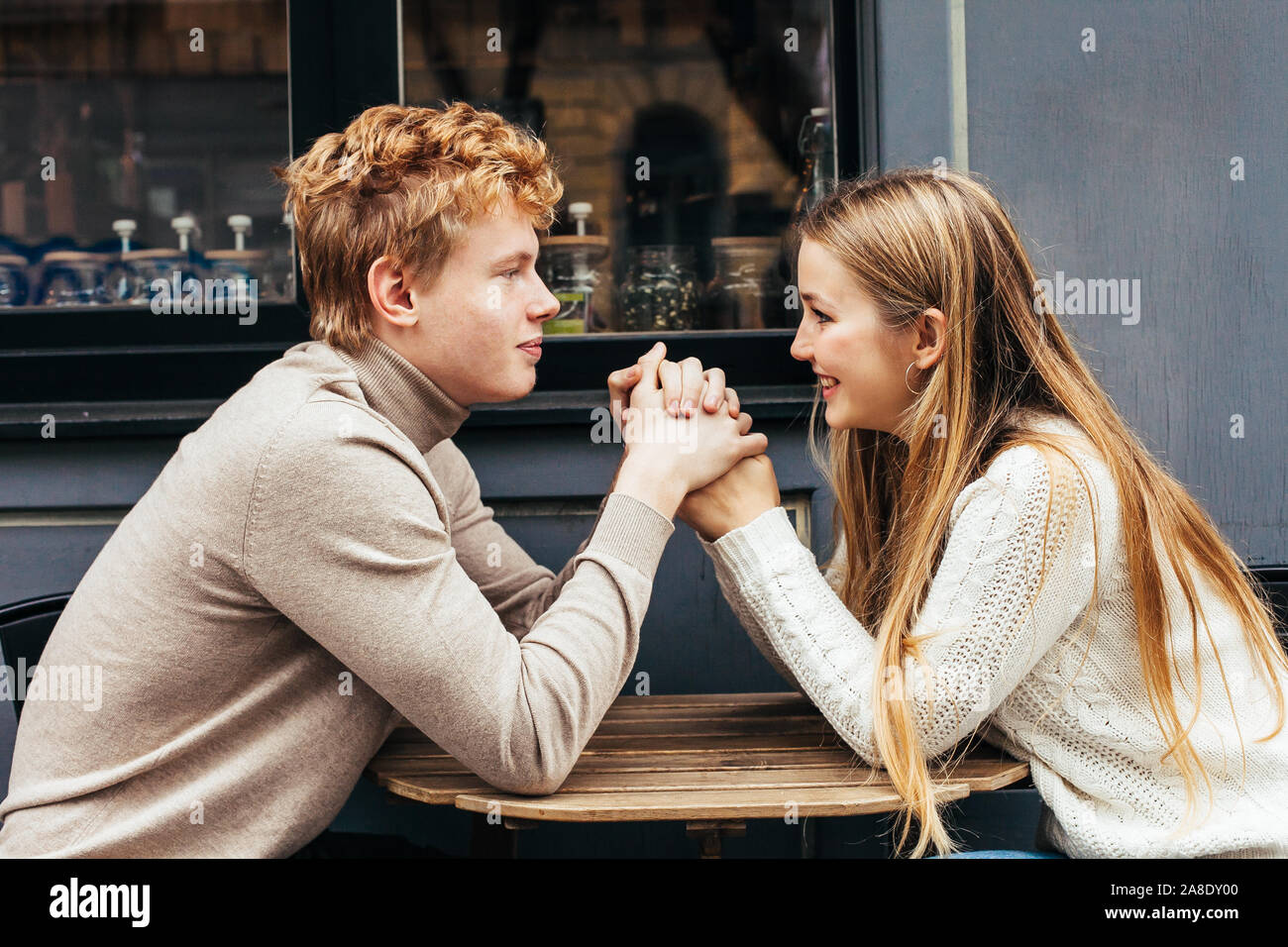 Portrait of a young couple in love in a cafe Stock Photo