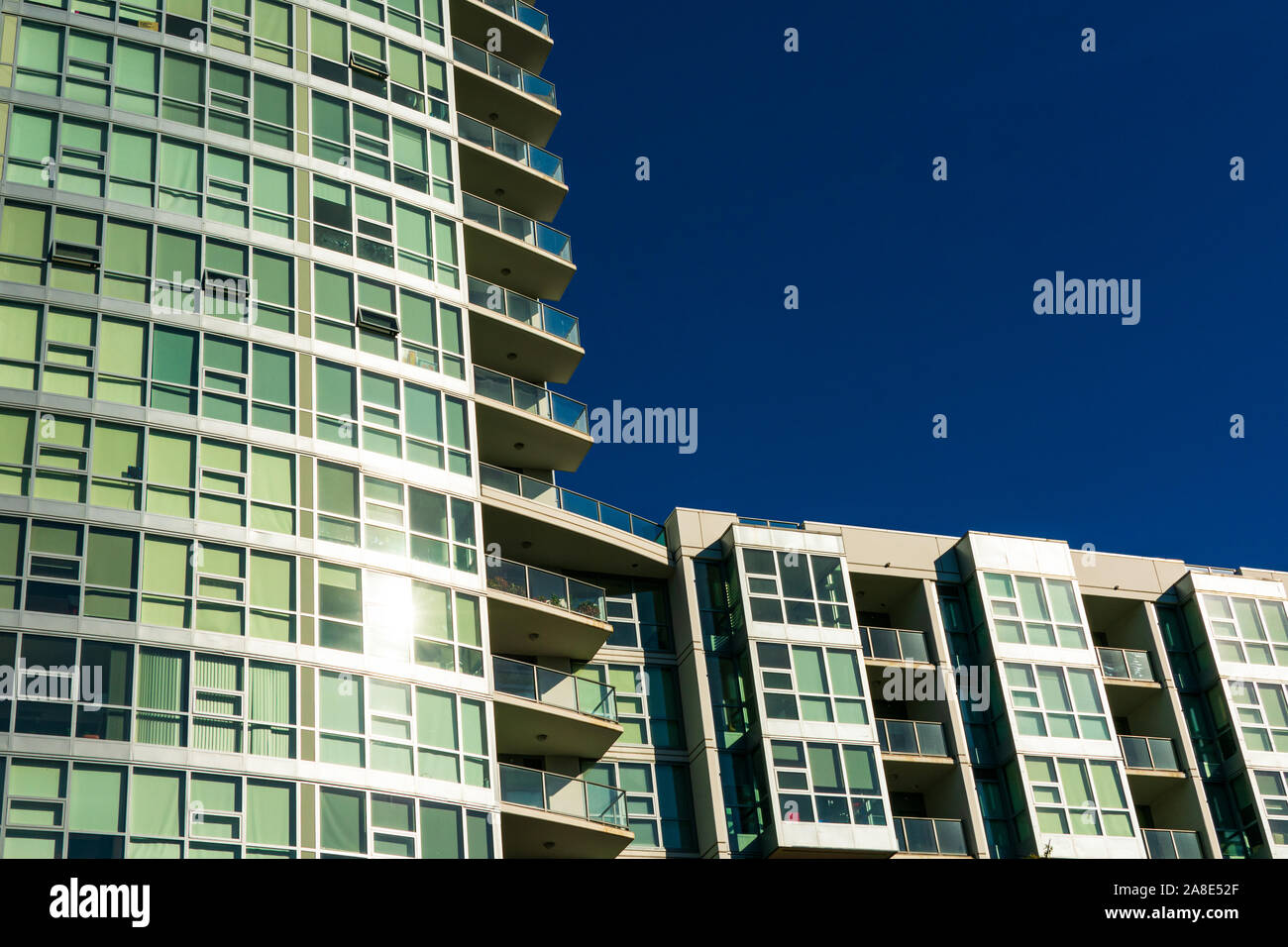 Exterior view of typical new multifamily mid-rise residential building. The buildings usually rental apartments, college dorms, condominiums, or assis Stock Photo