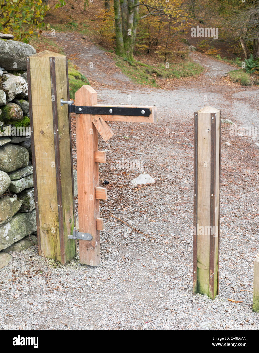 A gate, vandalised using a power saw, on the shore of Grasmere in the Lake District, Cumbria, England, UK Stock Photo