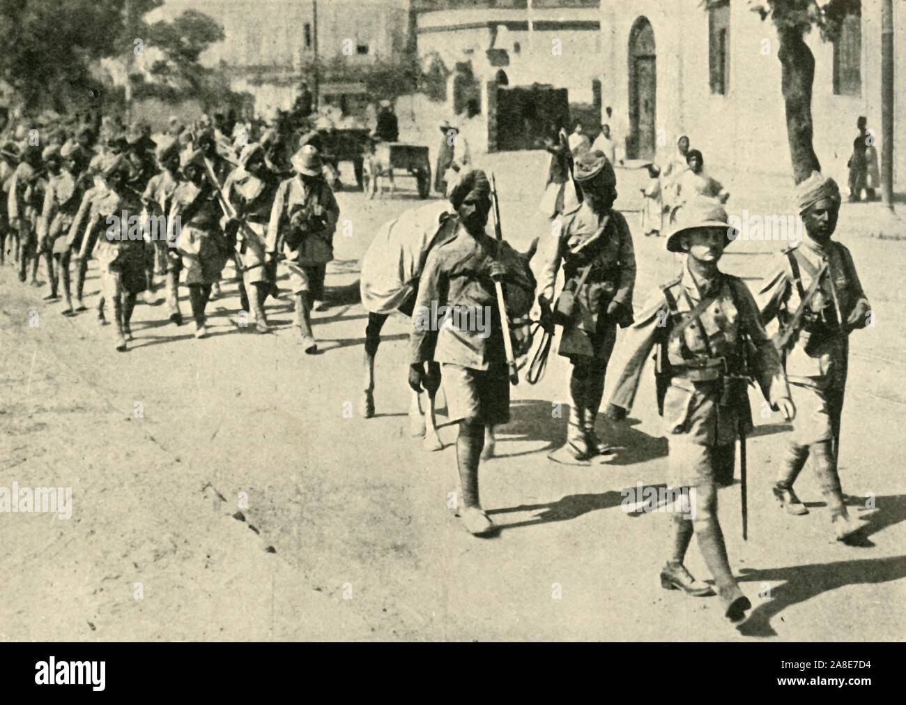 Indian soldiers and British officer, First World War, 1914-1918, (c1920). 'The Road to the Front: Indian troops on the march'. From &quot;The Great World War: A History&quot;, Volume V, edited by Frank A Mumby. [The Gresham Publishing Company Ltd, London, c1920] Stock Photo