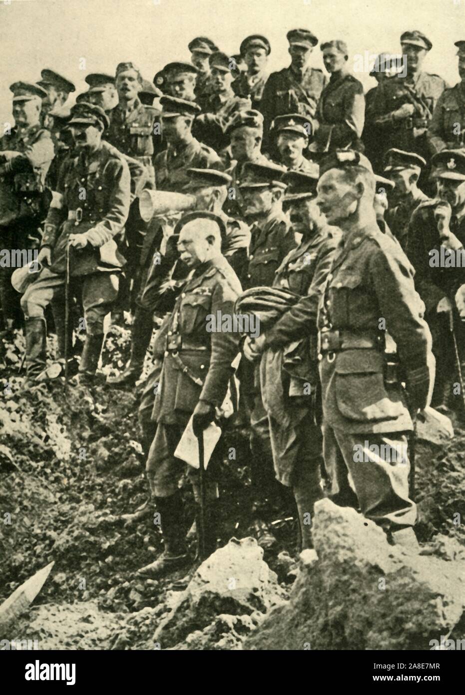 'General Sir Herbert Plumer inspecting the effects of a mine explosion', First World War, c1917, (c1920). 'The Second Army's Chief on the Flanders Front'. Herbert Plumer (centre), and fellow British officers on the battlefield, Belgian Western Front. From &quot;The Great World War: A History&quot;, Volume VII, edited by Frank A Mumby. [The Gresham Publishing Company Ltd, London, c1920] Stock Photo