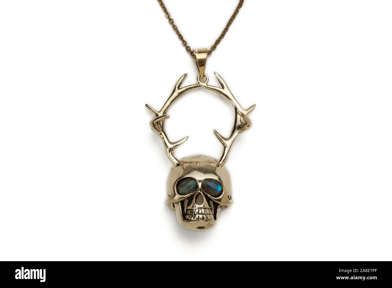 Silver human skull and stag antlers necklace pendant. Stock Photo