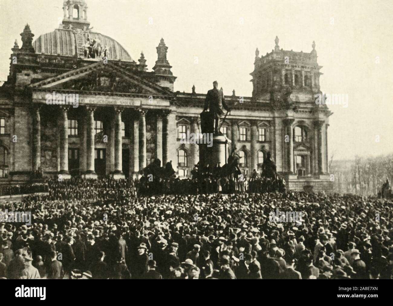 The creation of a new German republic, Reichstag, Berlin, 9 November 1918, (c1920). 'Berlin under the new Regime...scene outside the Reichstag during Herr Scheidemann's proclamation of a republic'. Philipp Scheidemann (1865-1939) speaking from the Reichstag at the end of the First World War. He served as the first Chancellor of the Weimar Republic, holding office from February until June 1919. From &quot;The Great World War: A History&quot;, Volume IX, edited by Frank A Mumby. [The Gresham Publishing Company Ltd, London, c1920] Stock Photo