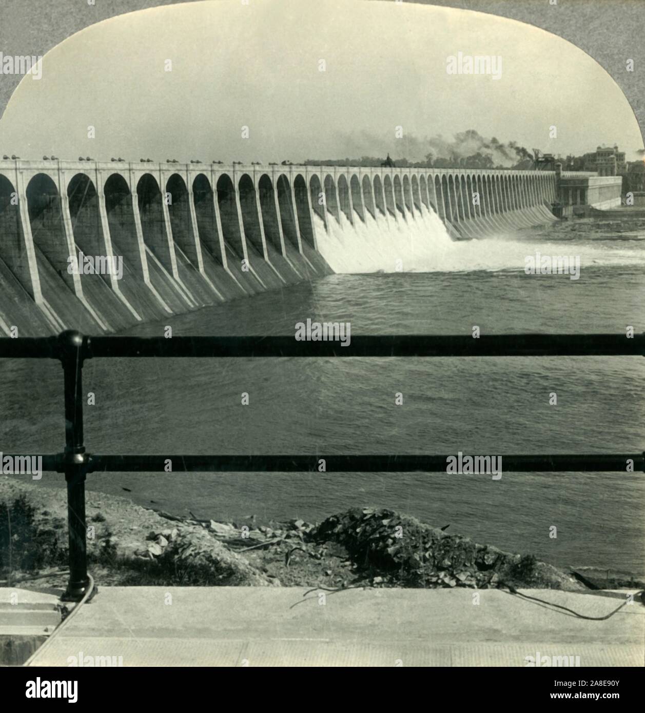 'Wilson Dam, Muscle Shoals, Alabama', c1930s. Construction of the Wilson Dam on the Tennessee River began in 1918 and was completed in 1924 under  Hugh L. Cooper, named after former President Woodrow Wilson, it became a National Historic Landmark in 1966. From &quot;Tour of the World&quot;. [Keystone View Company, Meadville, Pa., New York, Chicago, London] Stock Photo