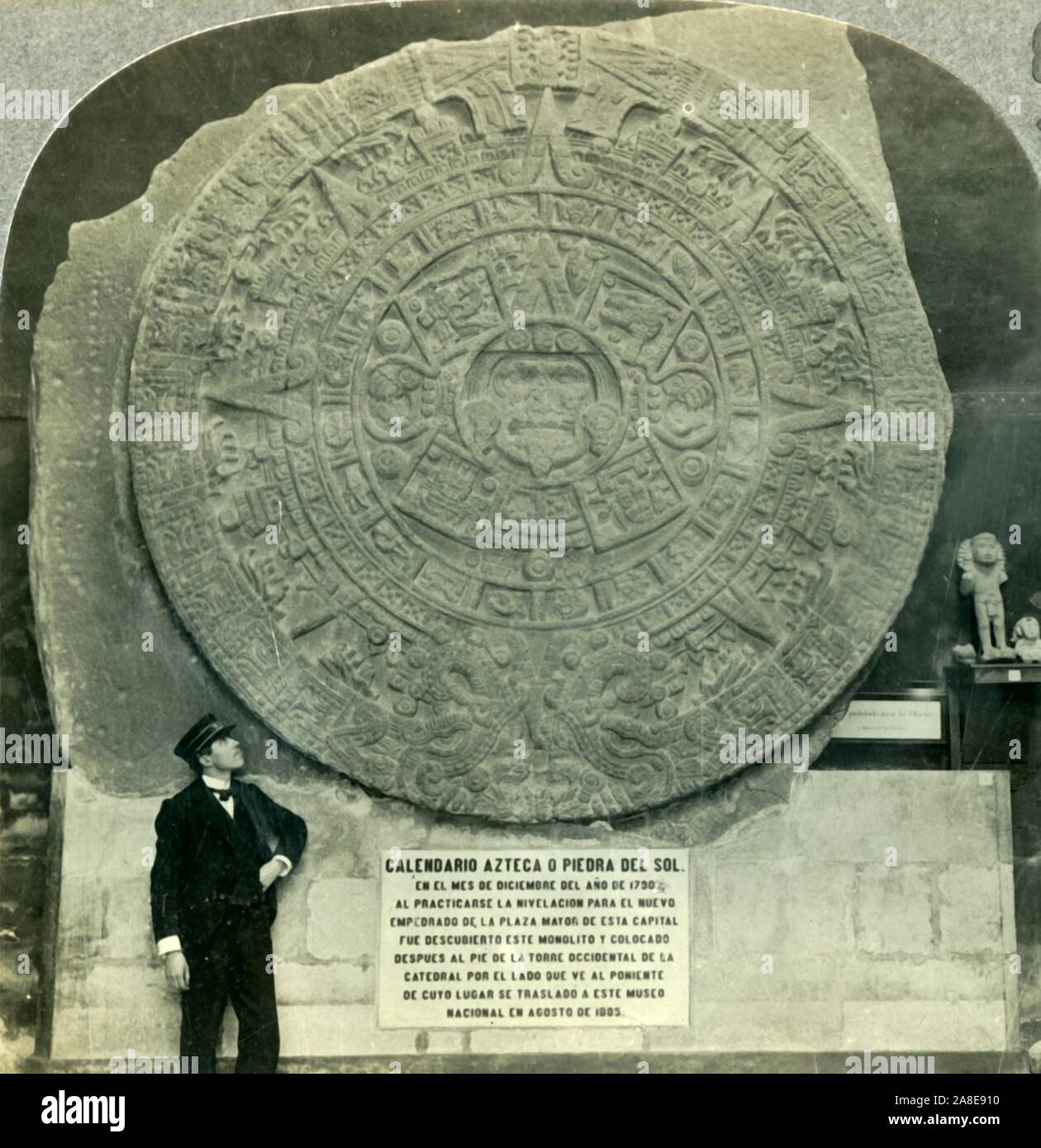 'The Aztec Calendar Stone, or Stone of the Sun, National Museum, Mexico City', c1930s. A name glyph of Aztec ruler Moctezuma II suggests the basalt Aztec sun stone was carved c1502- 1521, it depicts the cosmology of the Aztecs and is now in the National Anthropology Museum, Mexico City. From &quot;Tour of the World&quot;. [Keystone View Company, Meadville, Pa., New York, Chicago, London] Stock Photo
