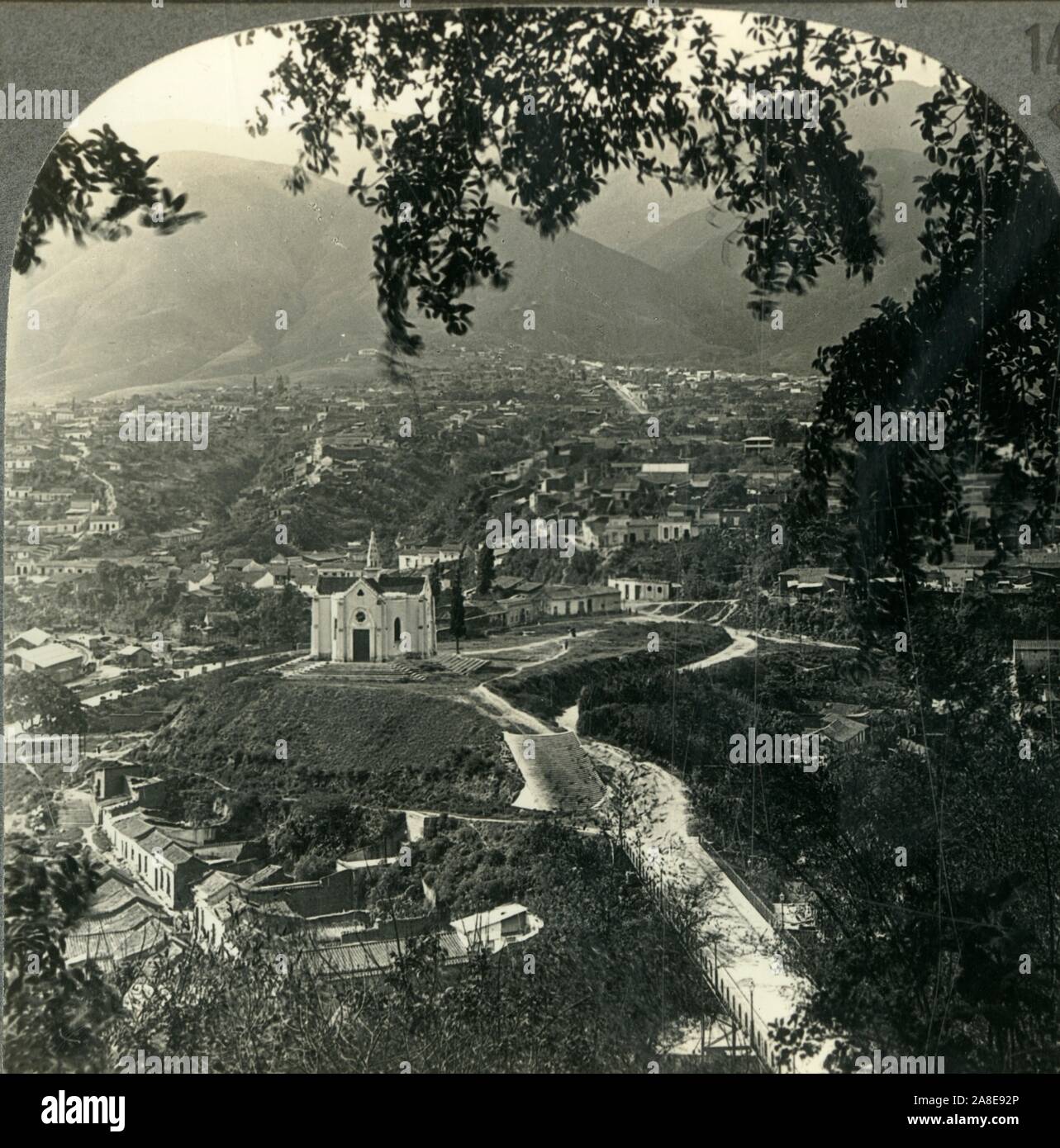 'Overlooking Caracas, the Capital of Venezuela.&quot;The Land Where It Is Always Summer&quot;.', c1930s. National Pantheon of Venezuela a former church on a hilltop in the valley of Caracas, capital city of Venezuela. From &quot;Tour of the World&quot;. [Keystone View Company, Meadville, Pa., New York, Chicago, London] Stock Photo
