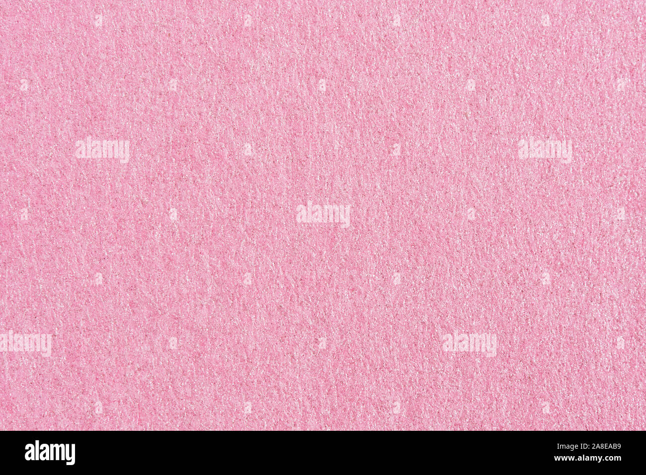Pink paper with abstract texture for background. Paper for interior and exterior decoration or background for handcrafts. Pink paper background. Stock Photo