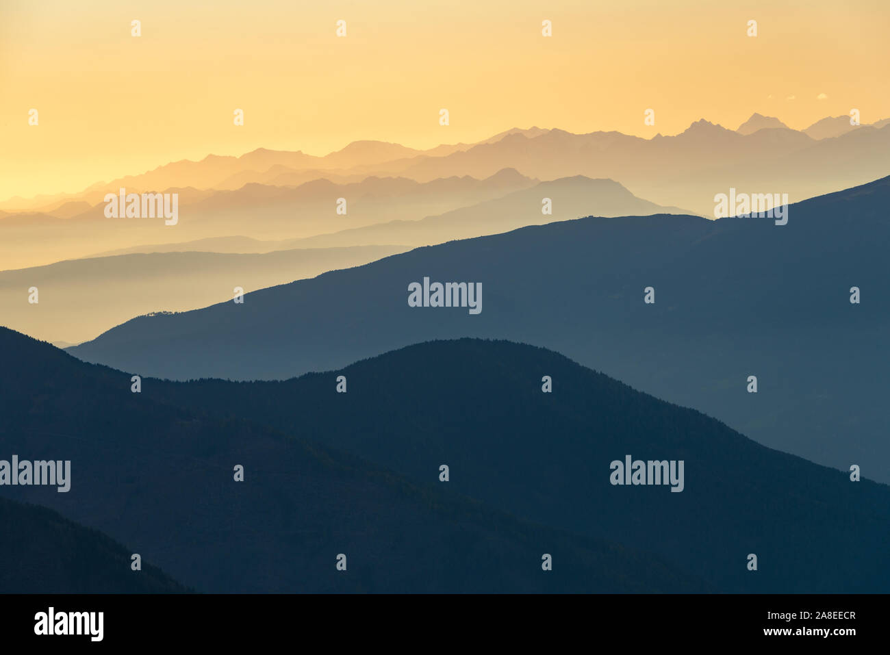 Mountain ranges of the Alps in the horizon at sunset Stock Photo
