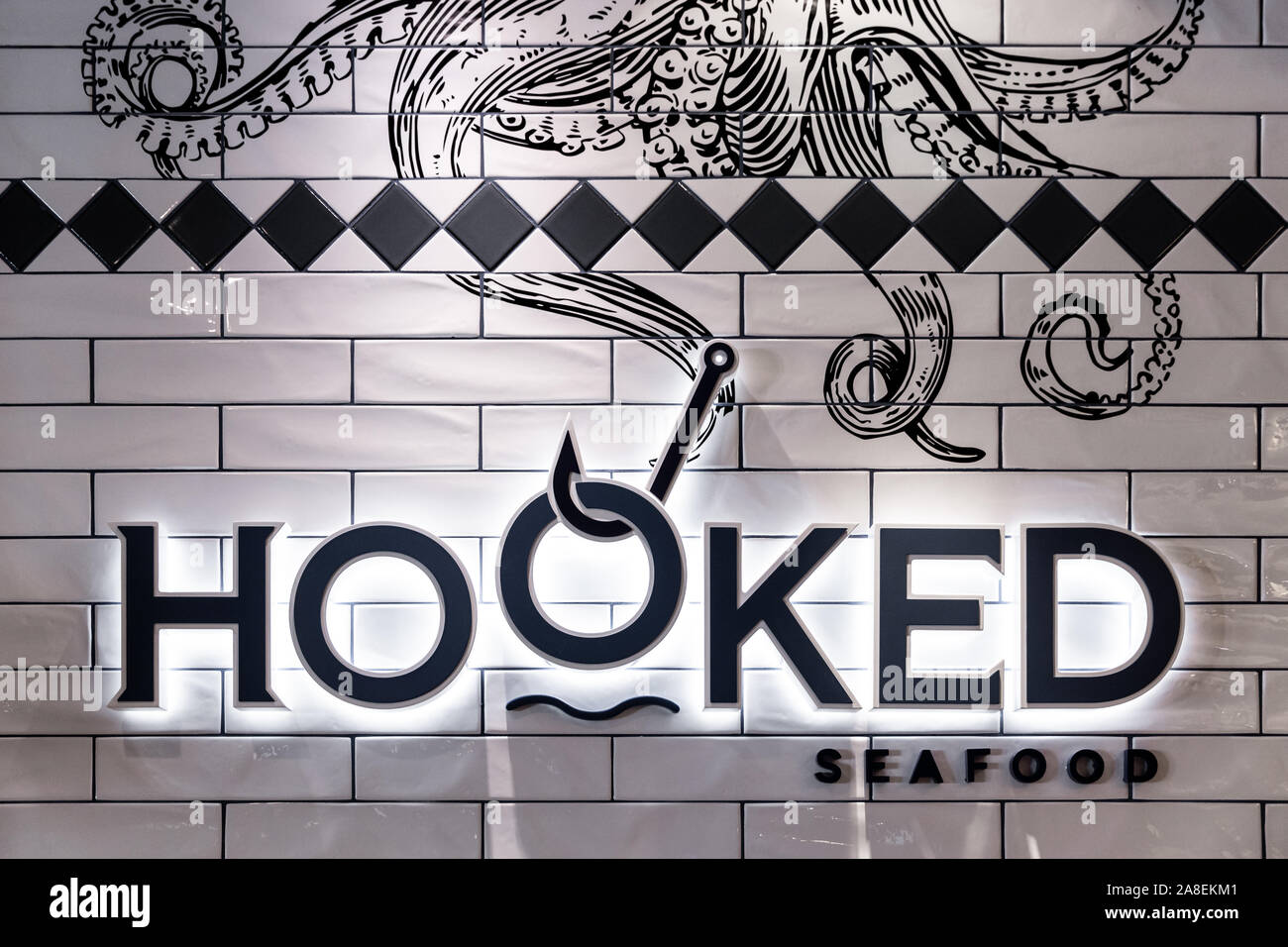 Hooked Seafood is a restaurant aboard Royal Caribbean ships and offers signature New England style seafood for guests aboard the ship. Stock Photo