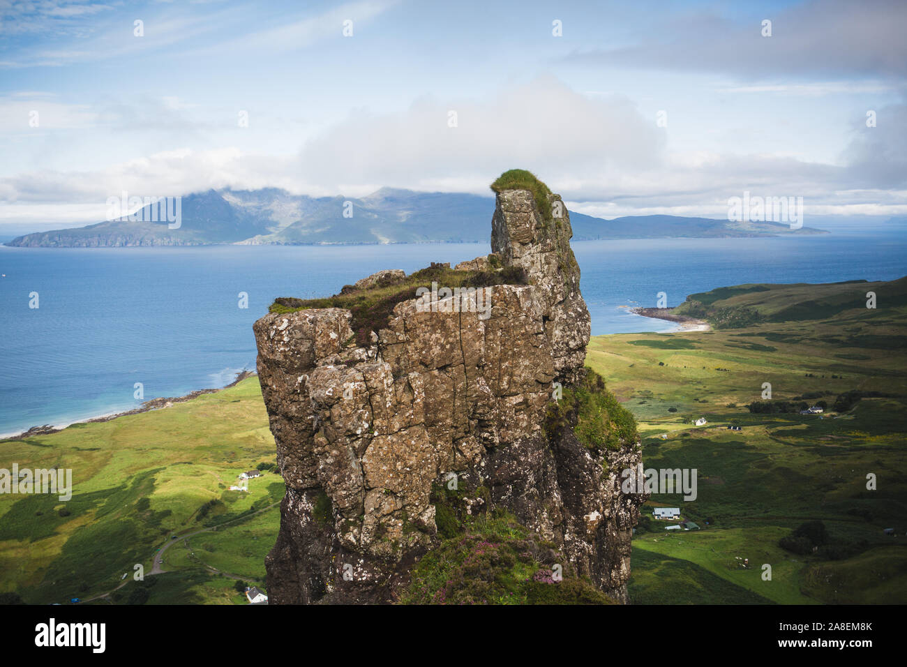 God's Finger, Isle of Eigg. Overlooking Cleadale and the Isle of Rum Stock Photo