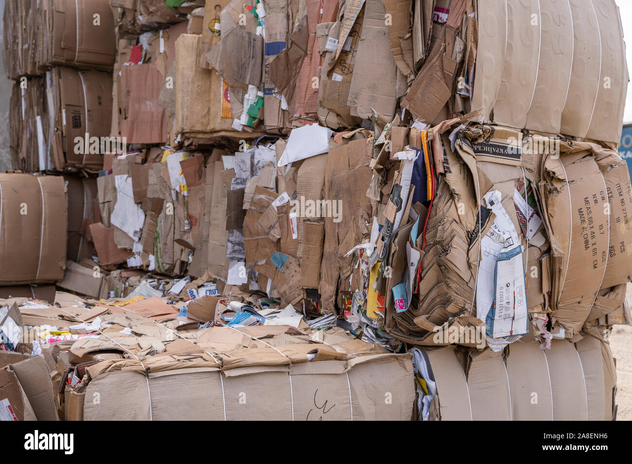 Bales of cardboard and box board with strapping wire ties. Background