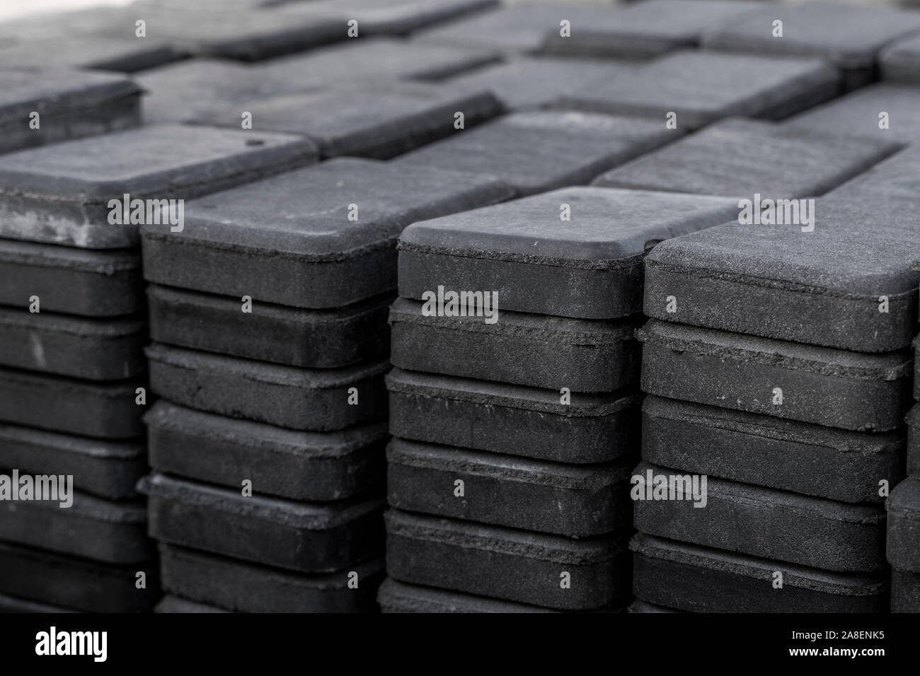Stack of paving stone on construction site. Bricks for paving stones stacked in stacks