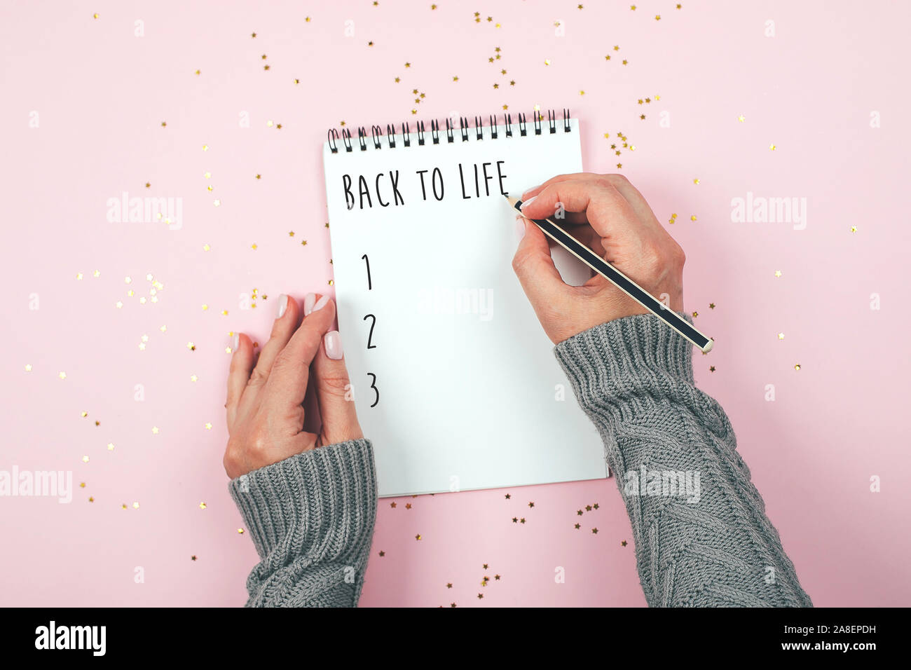 Download Back To Life Concept Woman S Hand Writing In Empty Notebook Mockup Concept Top View Flat Lay Copy Space Stock Photo Alamy