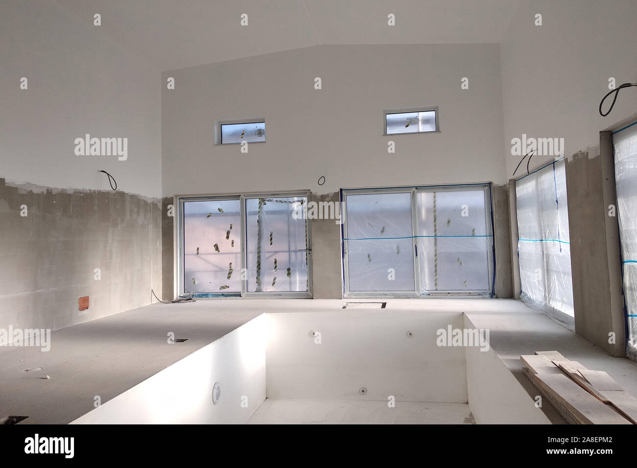 Interior of a house with big swimmig pool under renovation works Stock ...