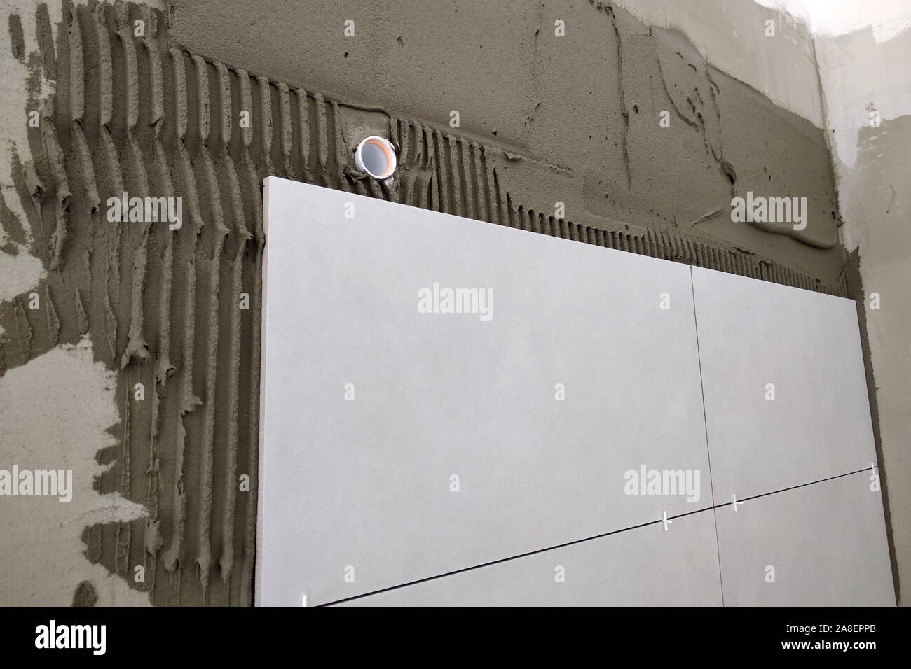 Wall ceramic tiles installation on mortar glue Stock Photo Alamy