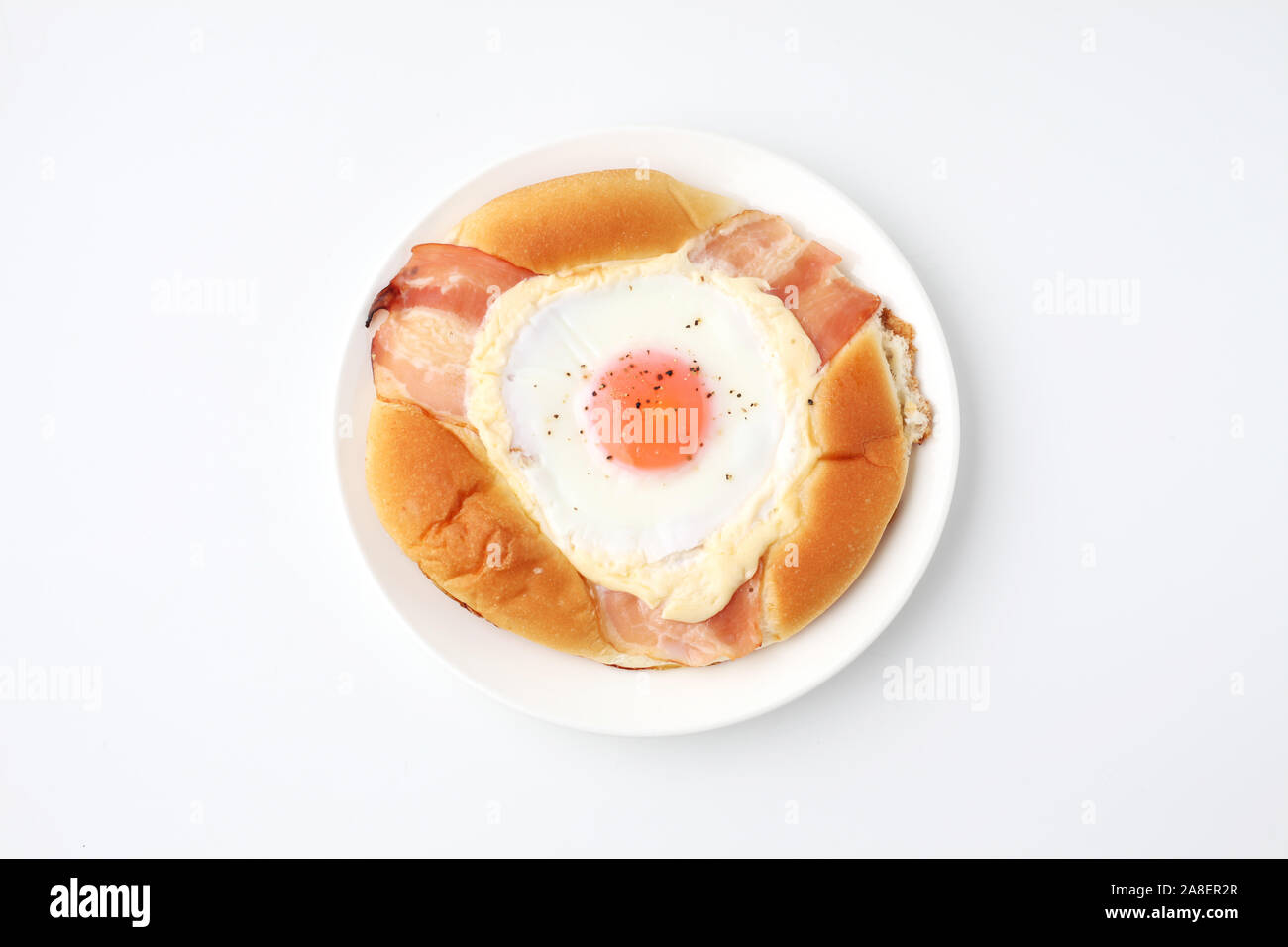 bacon egg bread on plate isolated on white background Stock Photo