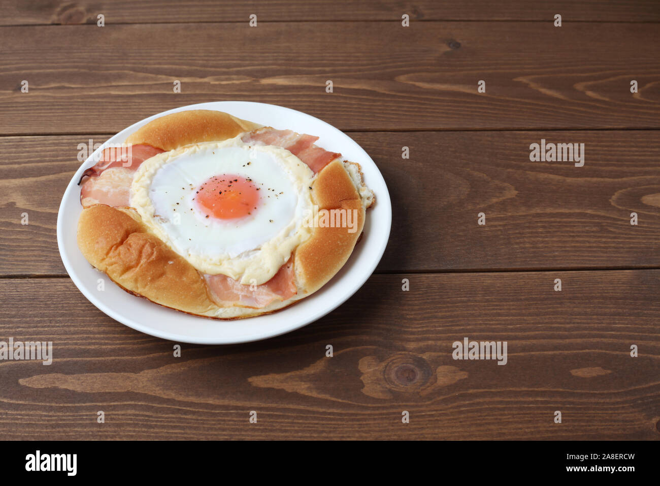 bacon egg bread on plate isolated on table Stock Photo