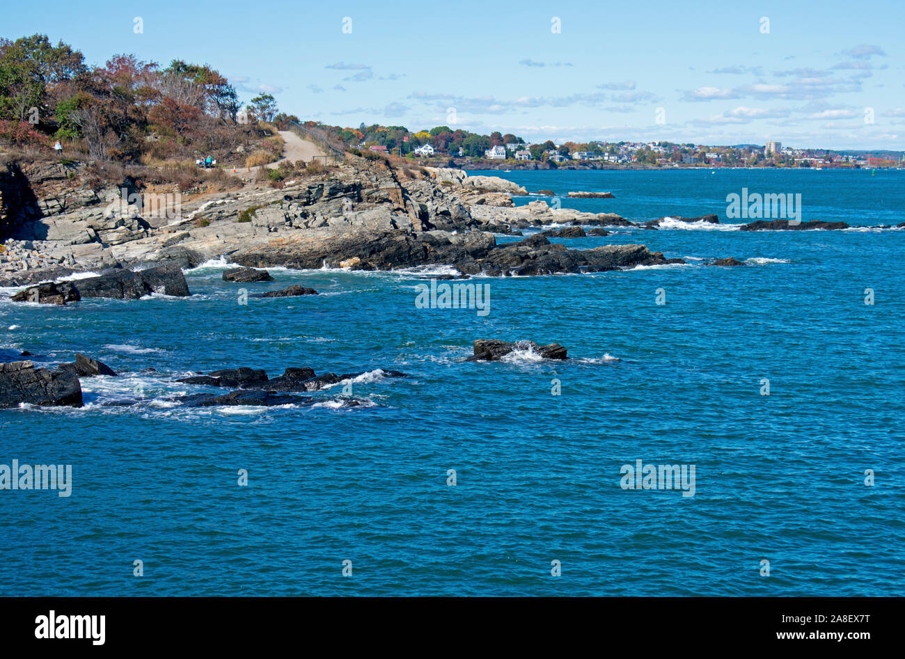 Small waves crashing into rocky shoreline viewed from Cape Elizabeth, Portland, Maine, USA. -07 Stock Photo
