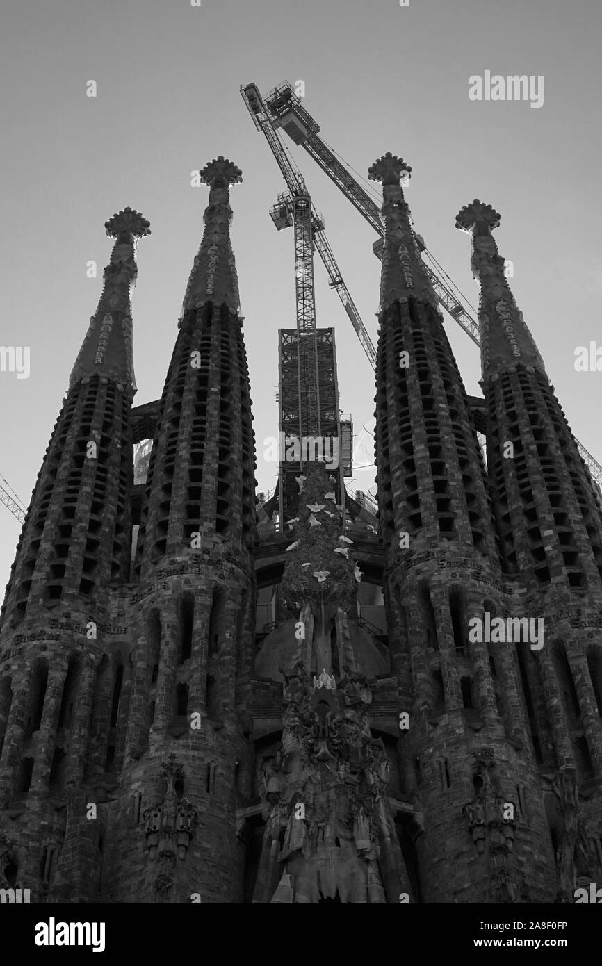 Monochrome image of the Basilica Sagrada Familia with cranes Stock Photo