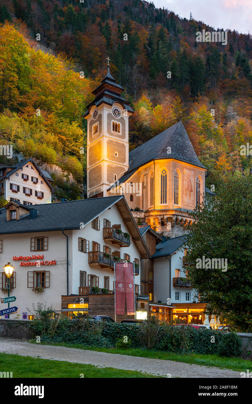 The Catholic parish church with fall foliage color in Hallstatt