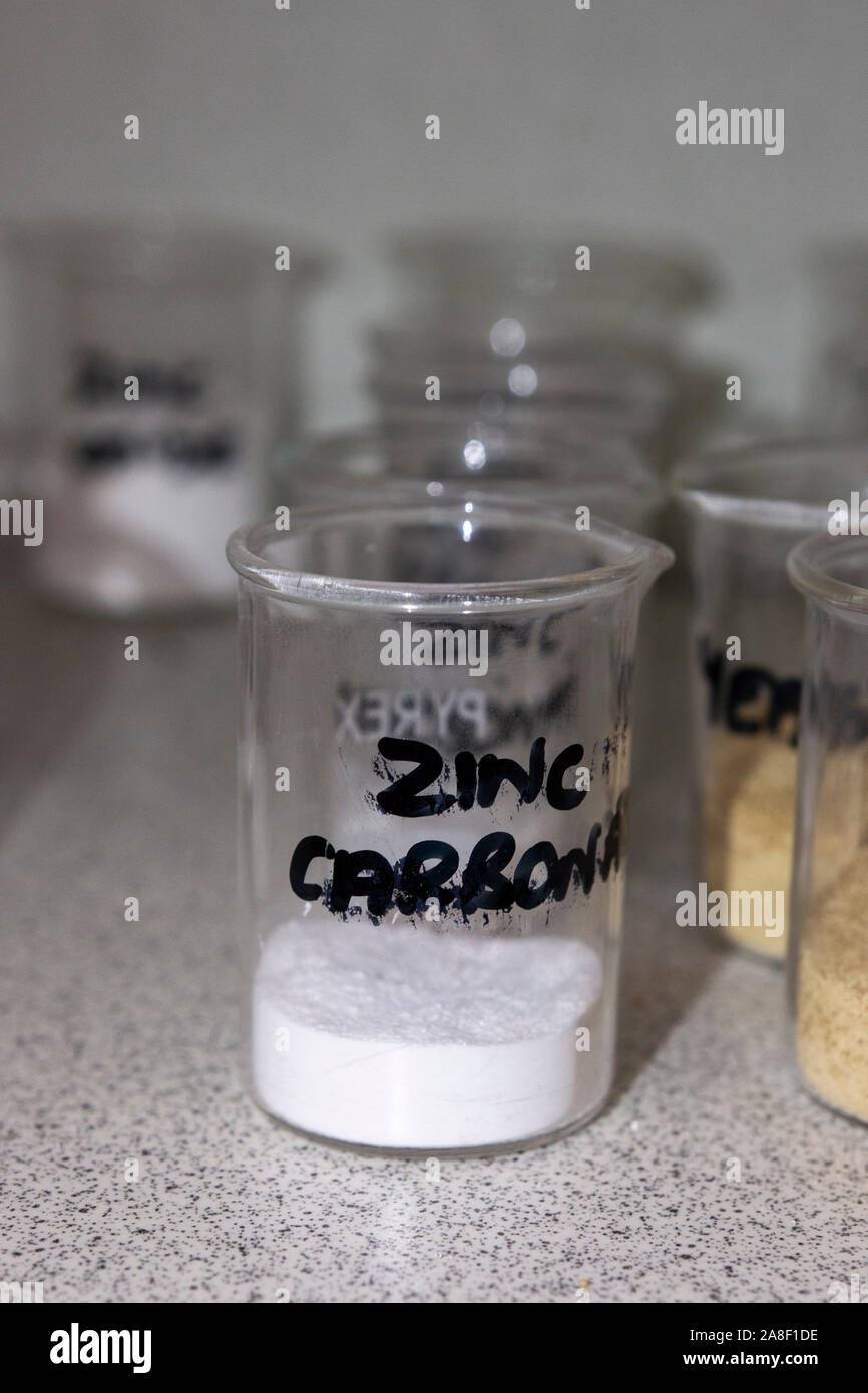 solid power sink carbonate in a glass beaker in a chemical store in the UK Stock Photo