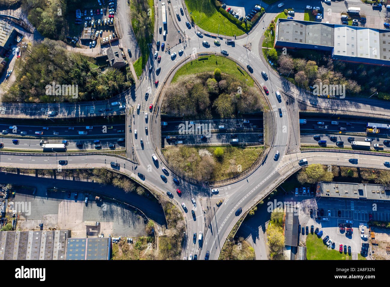 Aerial overhead view of a roundabout, highway during busy congestion ...
