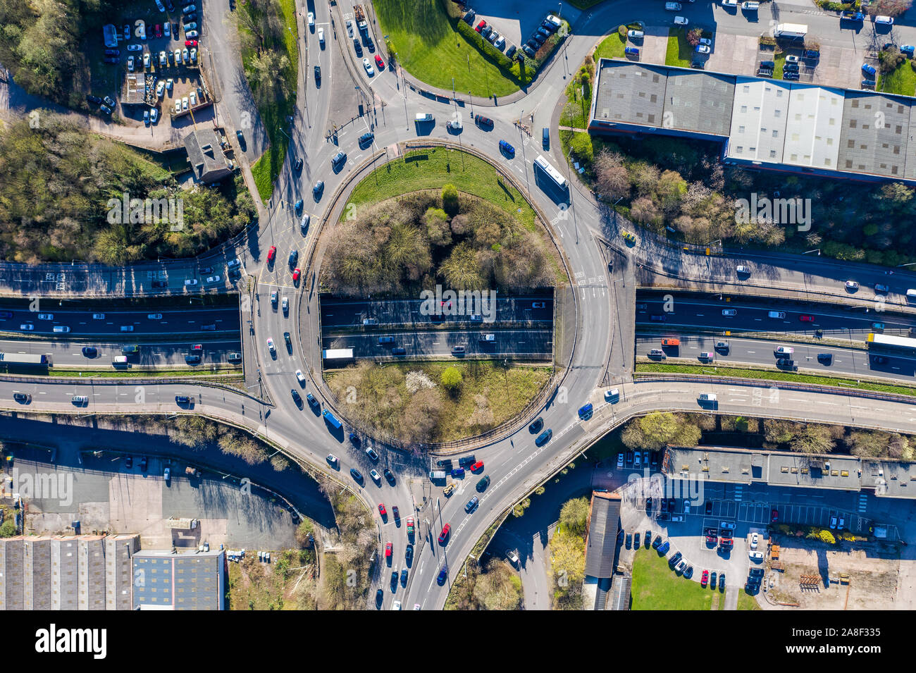 Aerial overhead view of a roundabout, highway during busy congestion ...