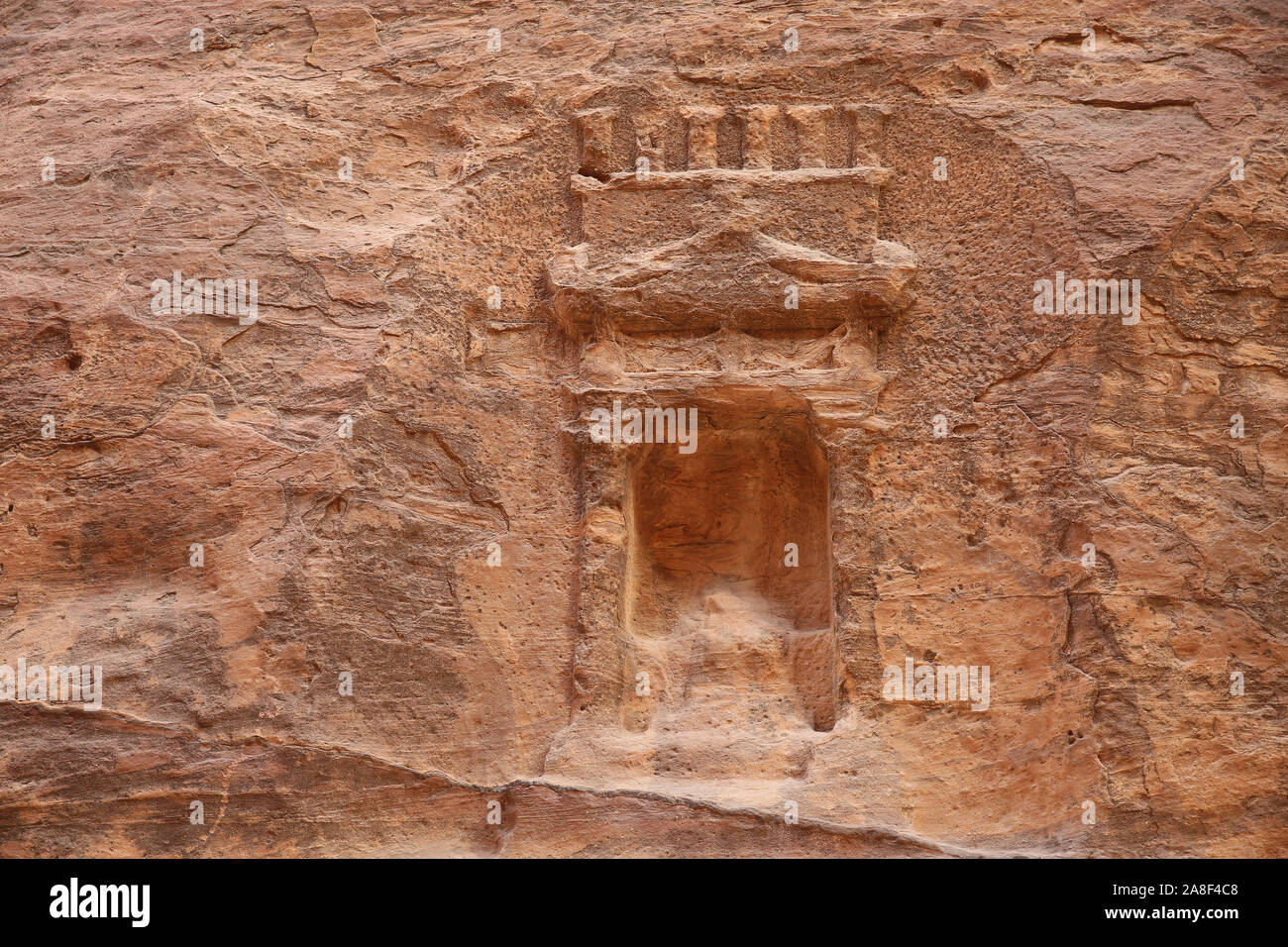 Carving in the sandstone cliffs of a window or entrance, Petra, Jordan. Stock Photo