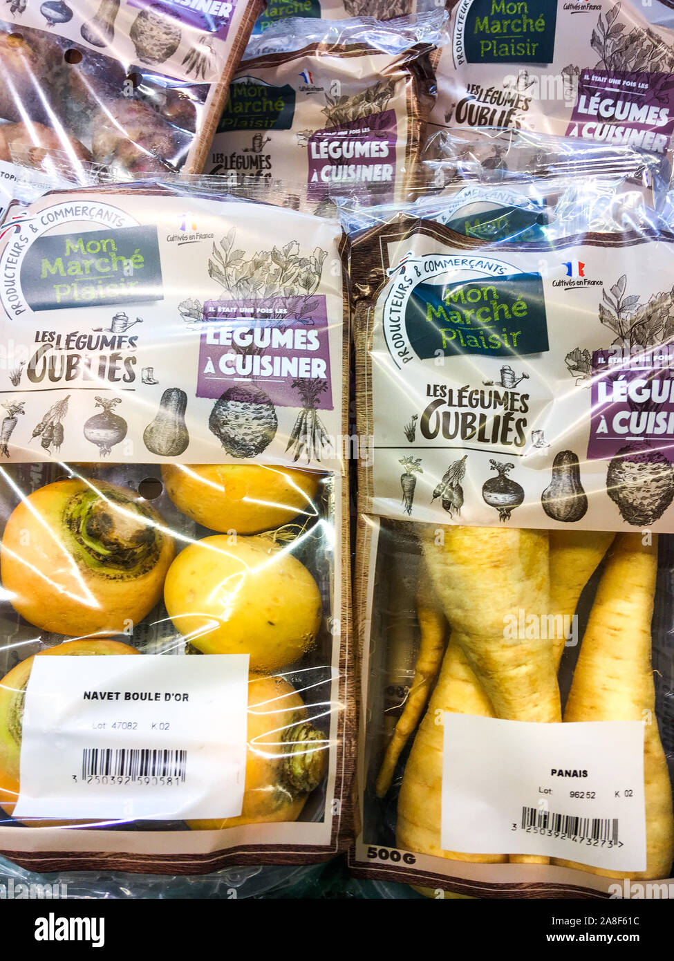 Forgotten vegetables under plastic package, Lyon, France Stock Photo