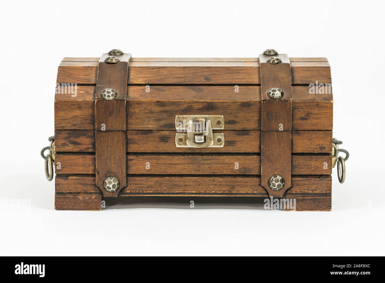 An old wooden chest inhabited by iron. Treasure chest. Isolated. Stock  Photo