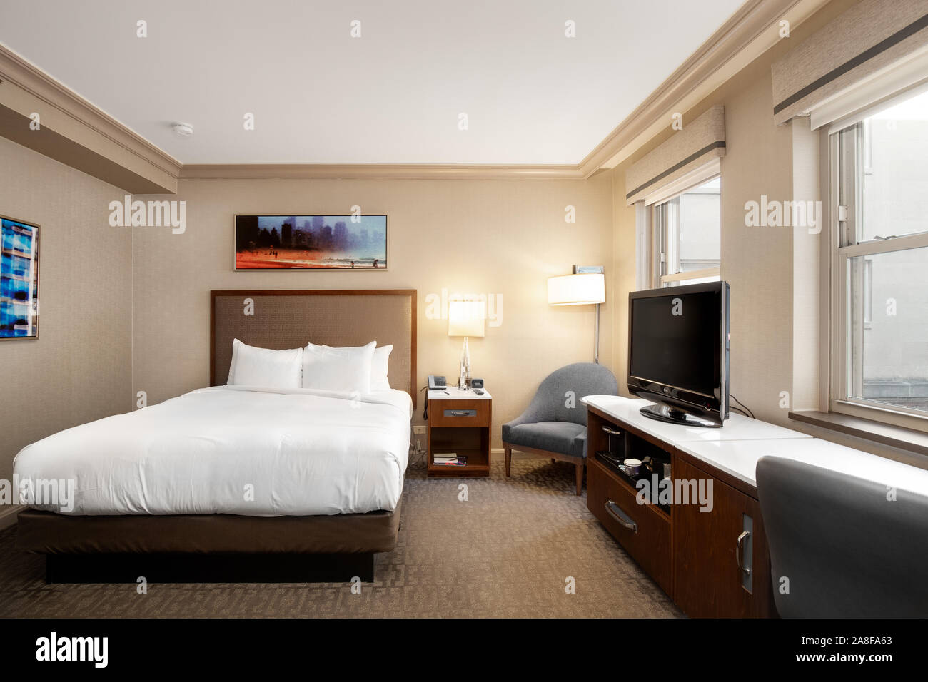 A standard hotel room at the Hilton Chicago with a king sized bed Stock