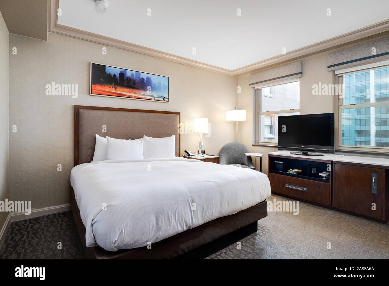 A standard hotel room at the Hilton Chicago with a king sized bed Stock