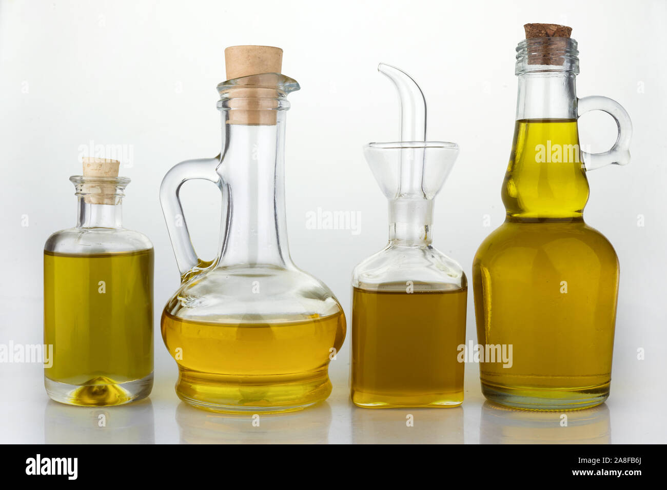 Set of virgin olive oil jars on a white Stock Photo Alamy