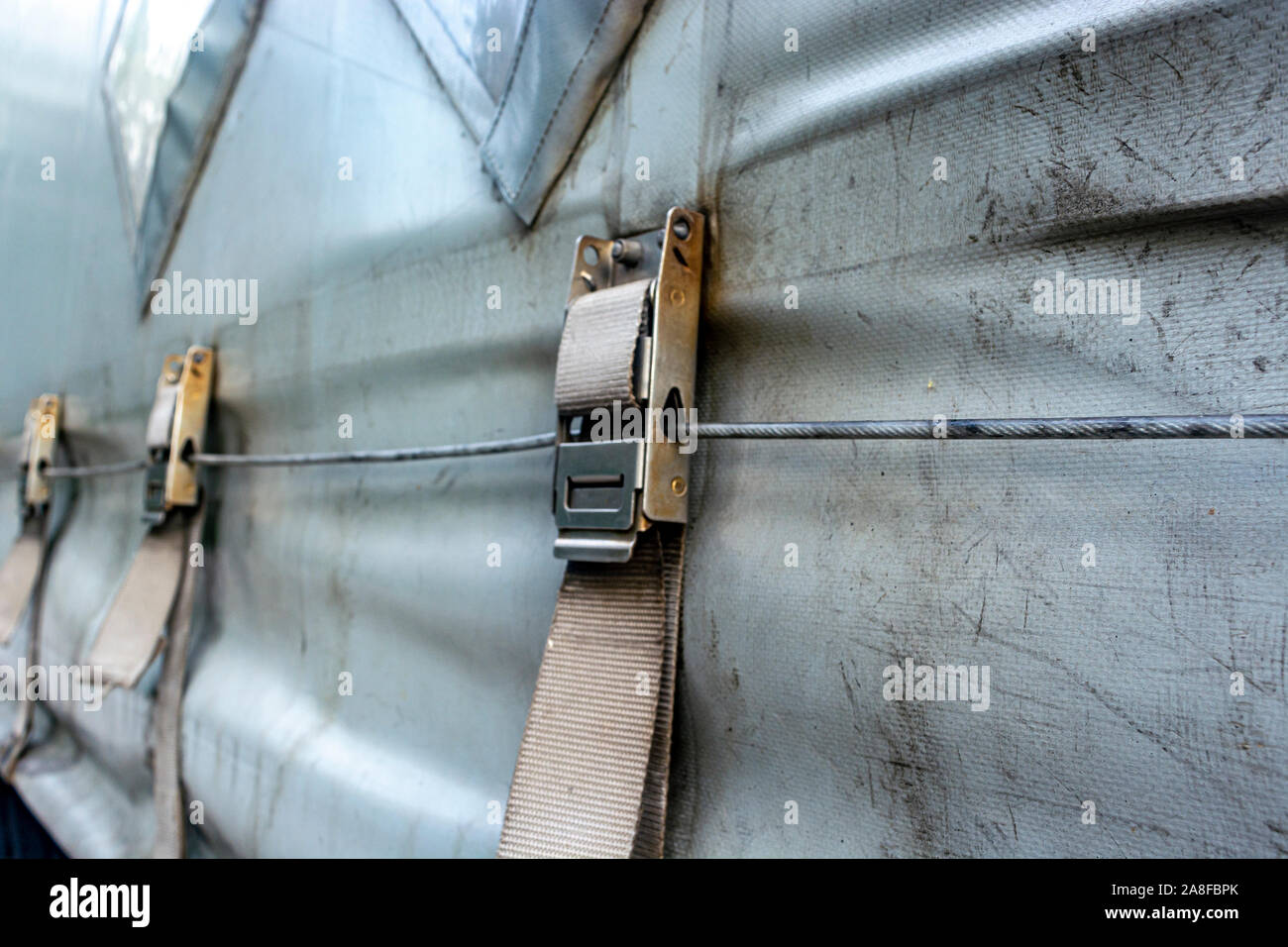 attaching the awning of the cargo trailer closeup Stock Photo Alamy