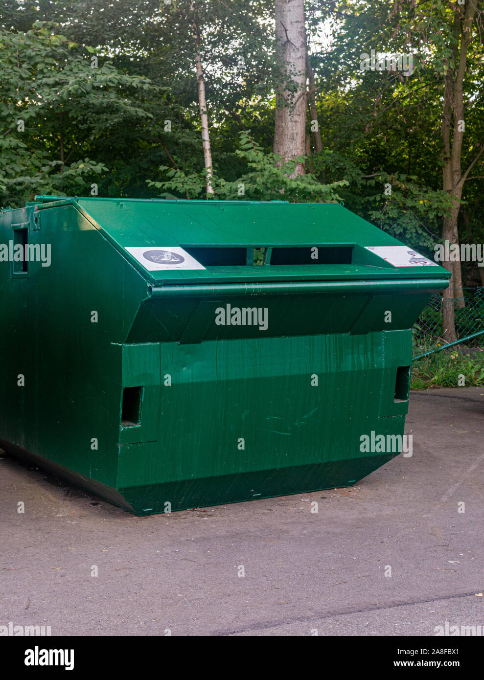 https://c8.alamy.com/comp/2A8FBX1/green-iron-recycling-containers-on-the-street-closeup-2A8FBX1.jpg