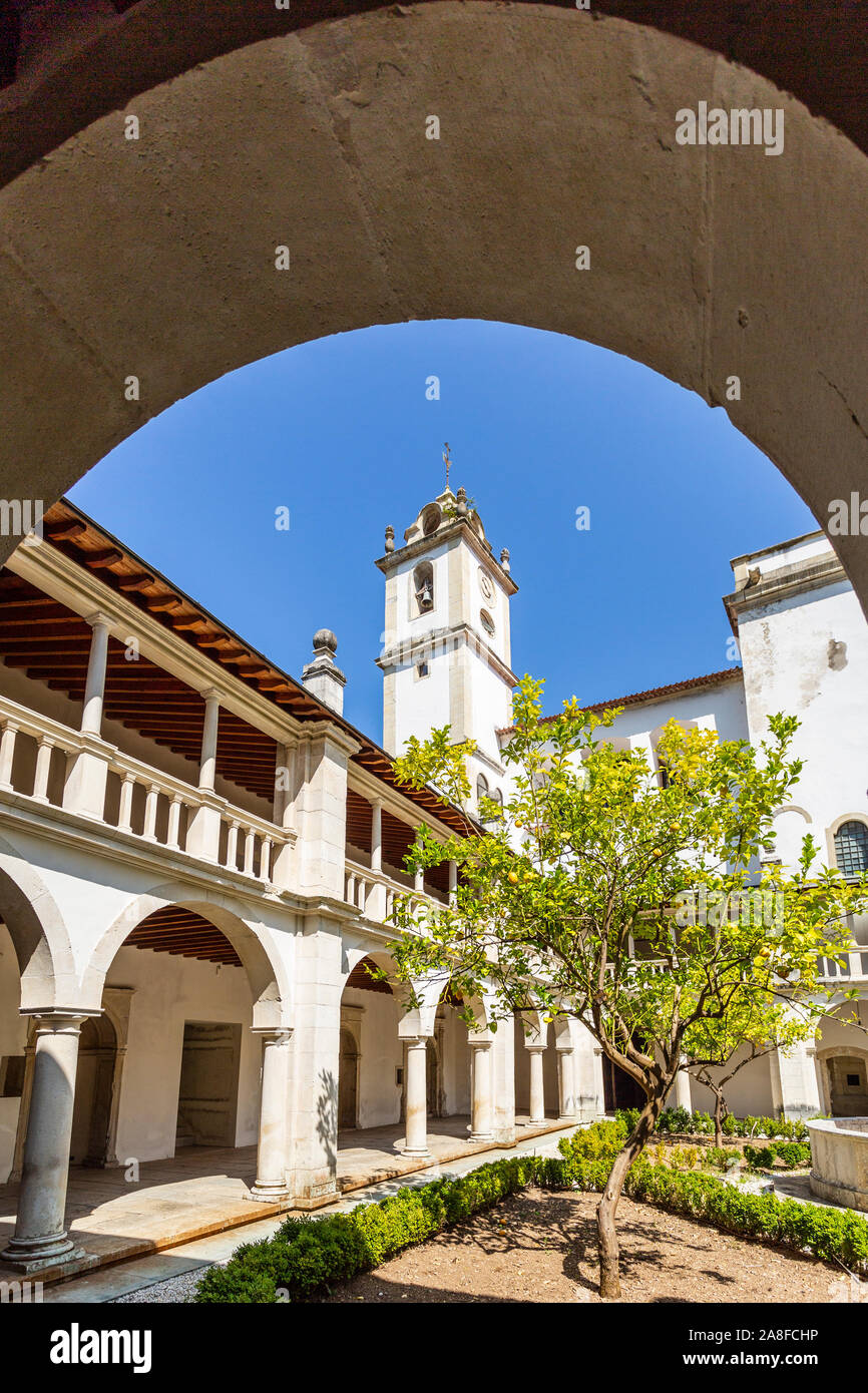Detail of the Renaissance cloister, with roman arches, Doric columns and the bell tower in the background, of the Monastery of Saint Mary of Lorvao, C Stock Photo