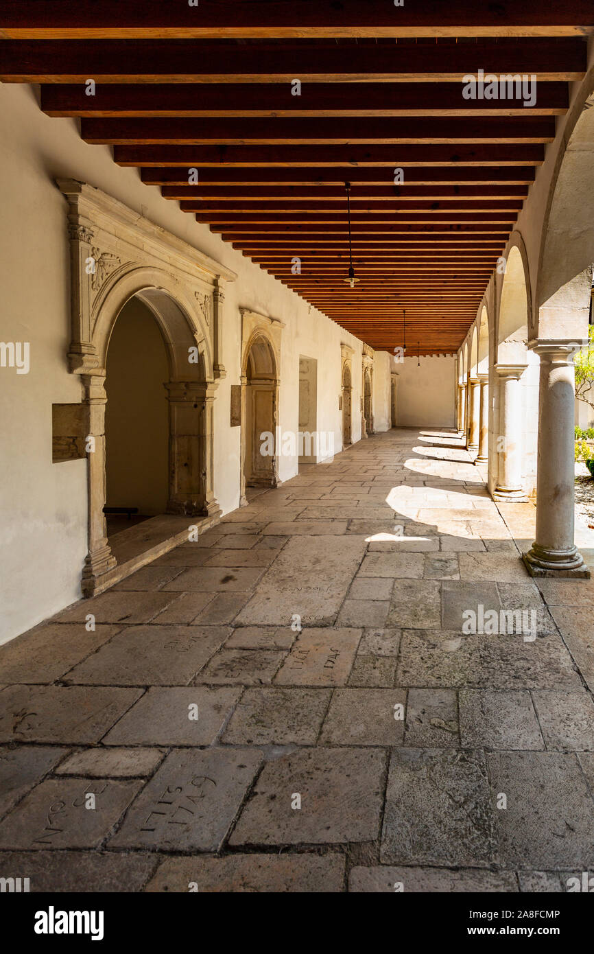 The ground floor of the Renaissance cloister and the side chapels with Romanesque capitals of the Monastery of Saint Mary of Lorvao, Coimbra, Portugal Stock Photo