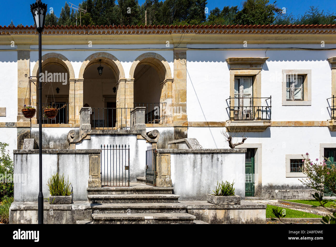 Facade of the former Priests House located in the front garden of the Monastery of Saint Mary of Lorvao, Coimbra, Portugal Stock Photo