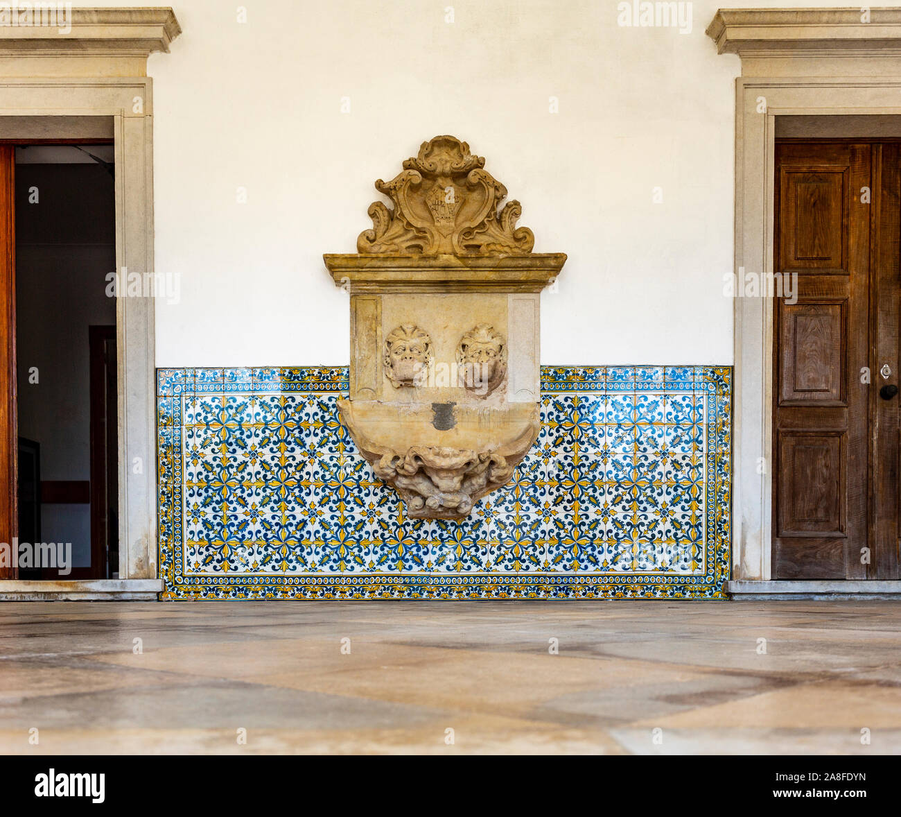 View of the ruined water fountain in the portico of the former Priests House of the Monastery of Saint Mary of Lorvao, Coimbra, Portugal Stock Photo