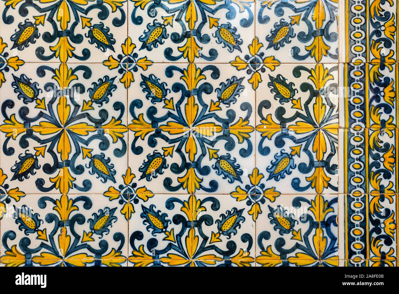 Detail of the wonderful 17th century tiles on the walls of the portico of the former Priests House of the Monastery of Saint Mary of Lorvao, Coimbra, Stock Photo