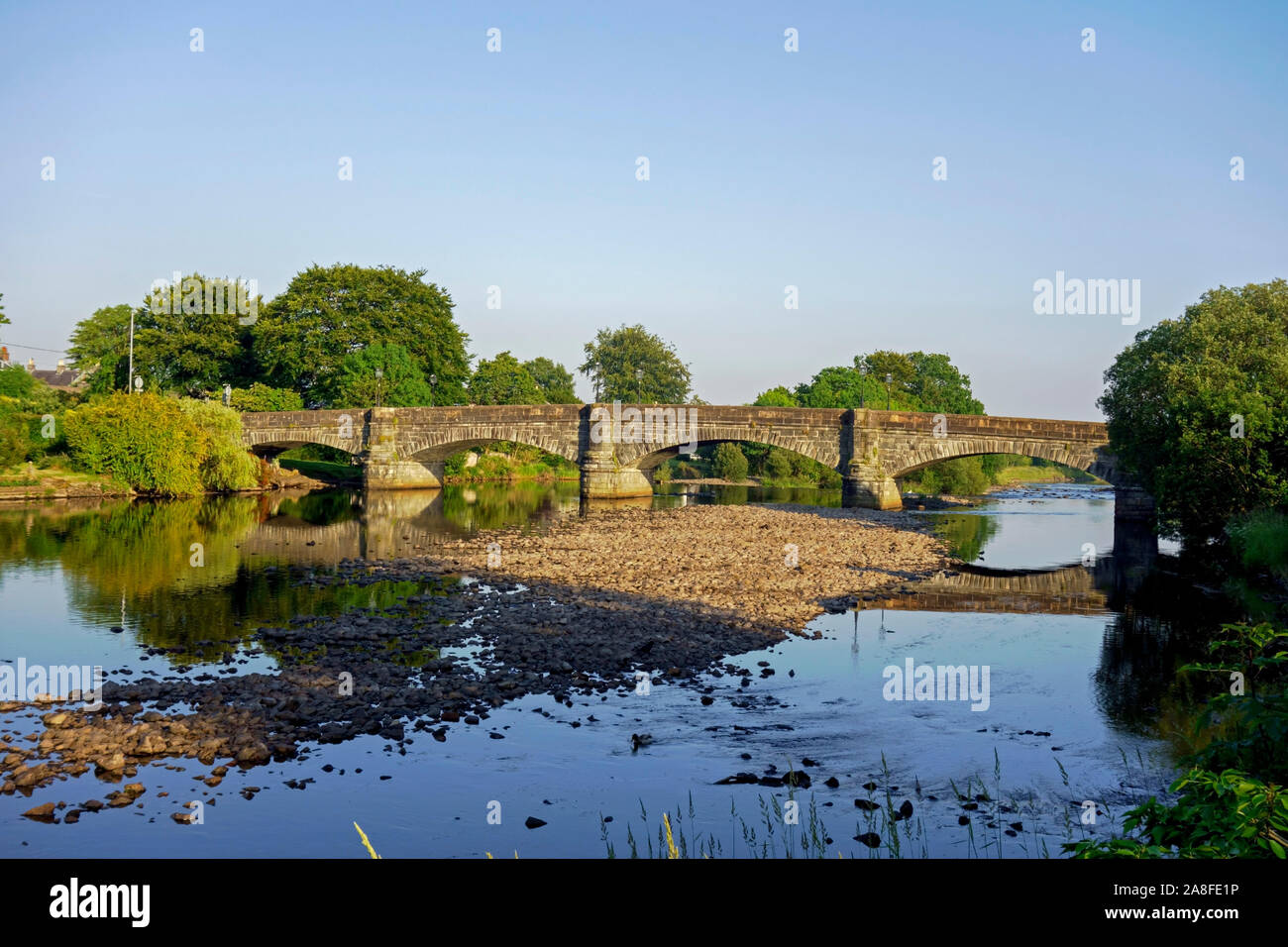 The north side of the bridge over the River Cree at Newton Stewart, Wigtownshire, Dumfries and Galloway, looking towards the village of Minnigaff. Stock Photo